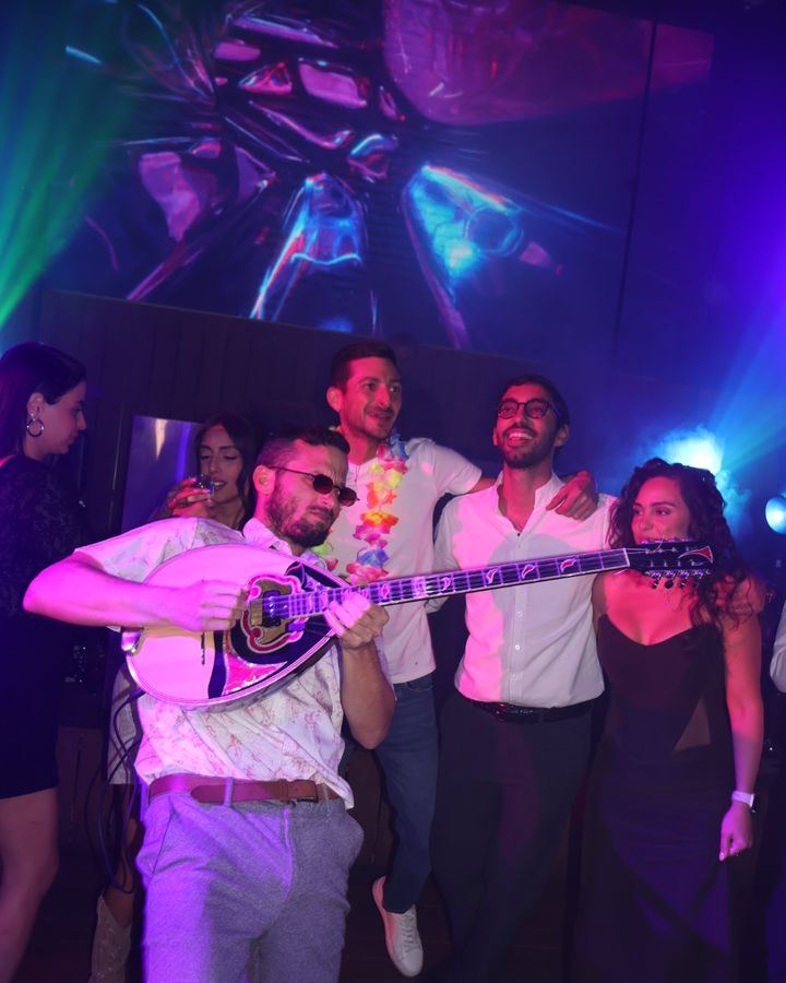 Bouzouki player for events – Ofer plays with friends at a party